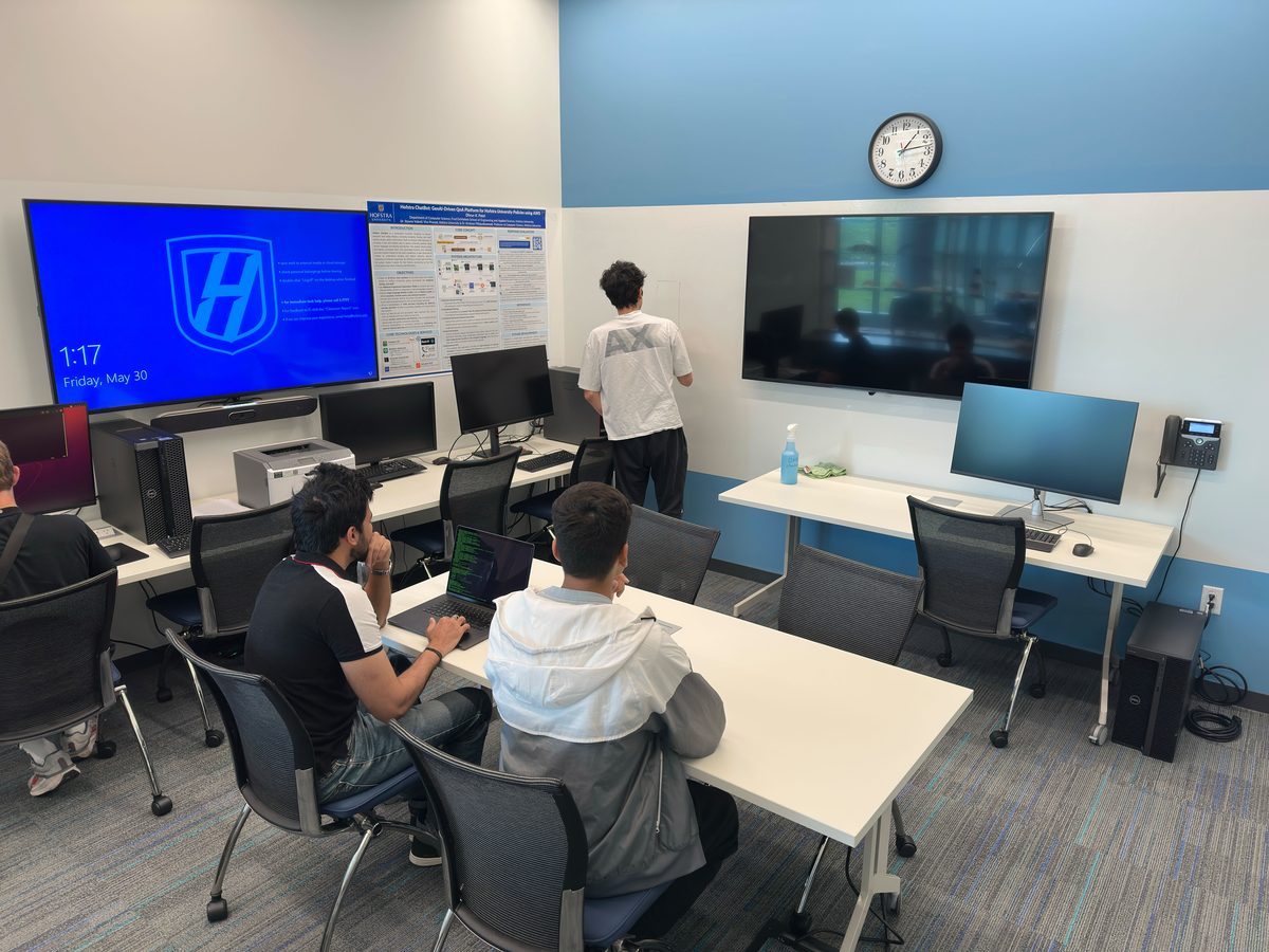 Students at work in the Intelligent Systems Lab, with its wall displays and workstations
